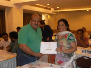 VIMALJI GIVING A CERTIFICATE OF PARTICIPATION IN HIS WORKSHOP